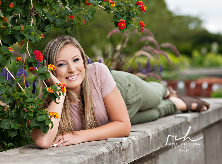 Charlotte high school senior in flower garden for senior portraits